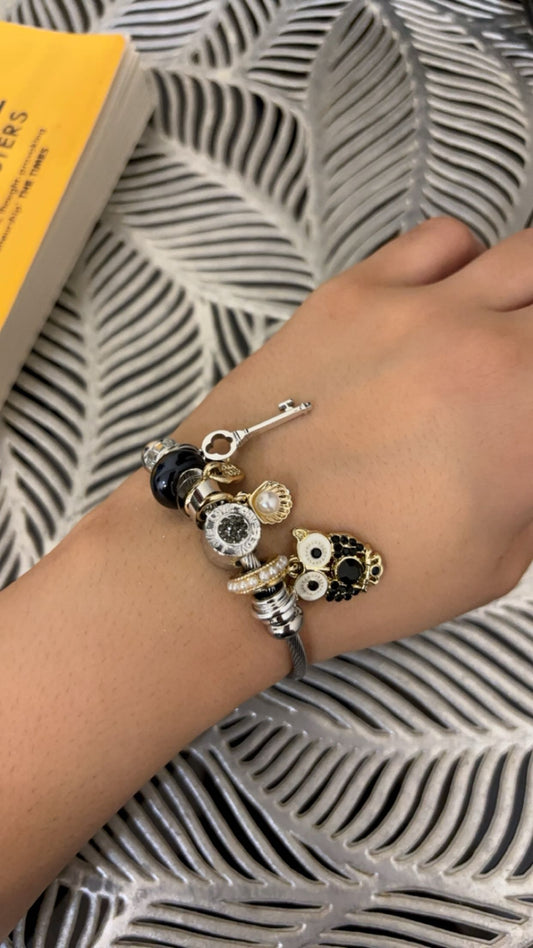 https://blingupp.com/products/owl-charm-bracelet